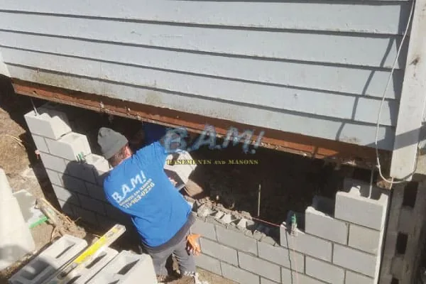 Foundation repair using carbon fiber straps and wall anchors — BAM Basements & Masons Des Moines Iowa